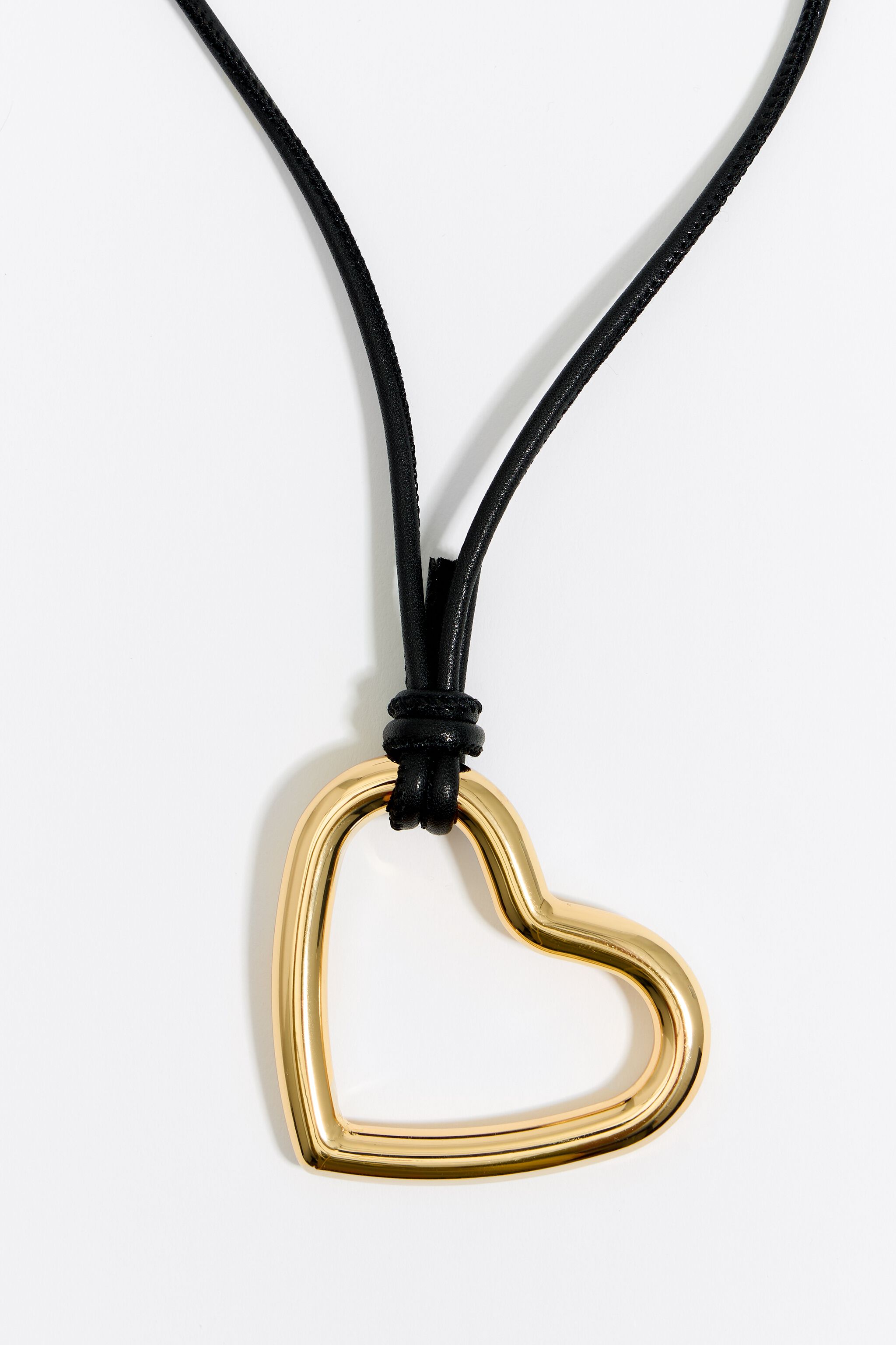 Gold heart and leather necklace