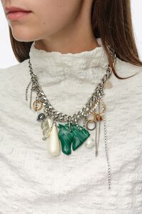 Charm necklace with rings, pearls and horse