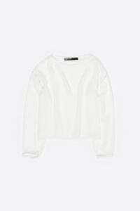 White boxy sweater with metallic beads
