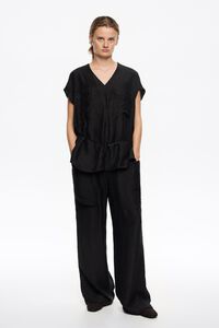 Washed black fluid trousers with maxi pockets
