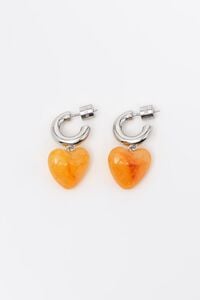 Silver hoop earrings with yellow resin heart