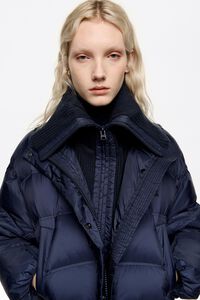 Navy blue down jacket with maxi knit neck