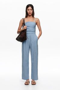 Blue striped jumpsuit with gathered straps