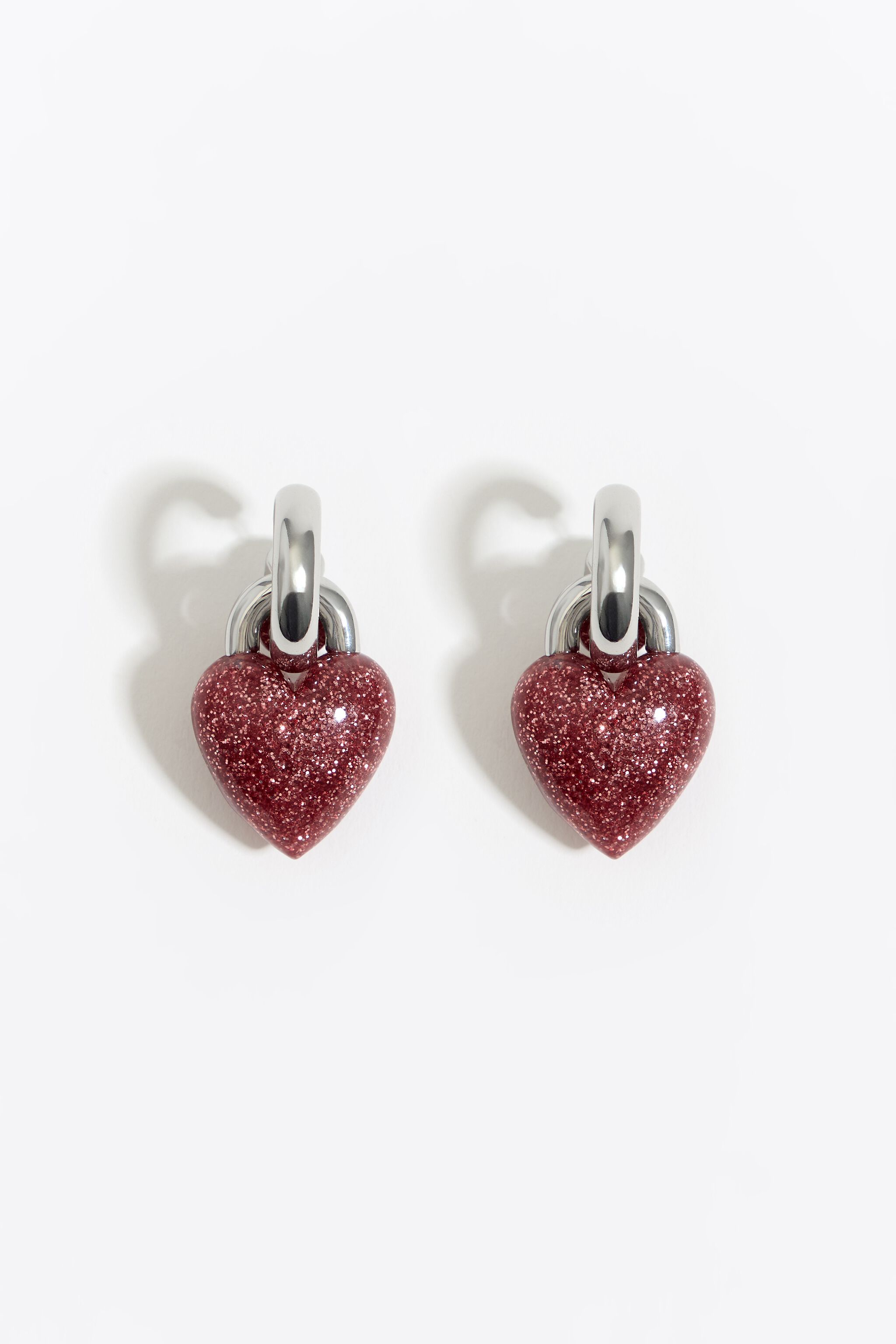 Hoop earrings with red glitter heart