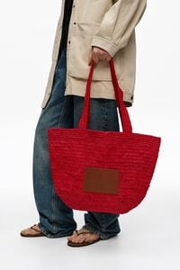 Large red plaited bag