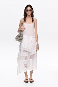 White embroidered top with asymmetrical handkerchief hem
