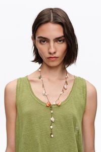 Aged gold necklace with ceramic fish and shells