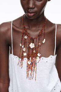 Multicolored beads and mother-of-pearl tassel necklace