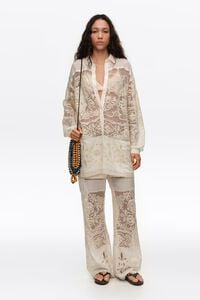 Ecru trousers with embroidery and openwork