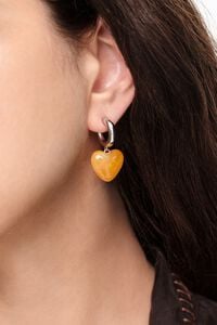 Silver hoop earrings with yellow resin heart