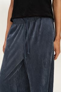 Dark blue fluid corduroy jogger trousers