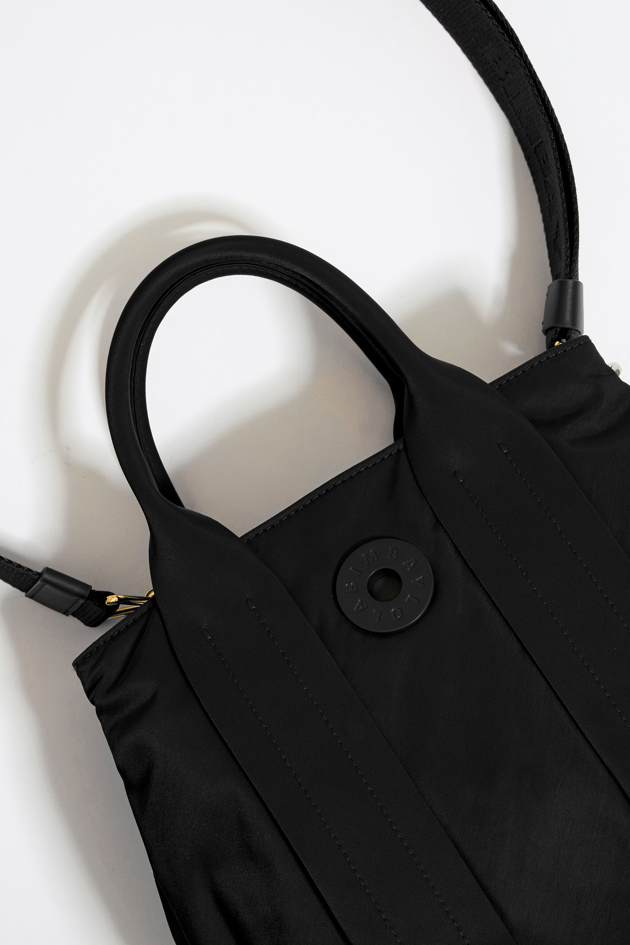 Small black handbag with long strap outlet