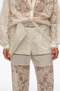 Ecru trousers with embroidery and openwork